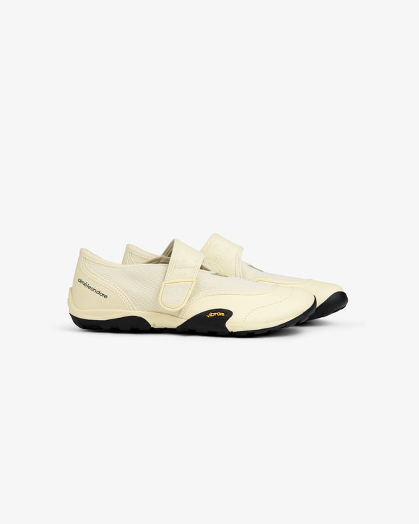 Off-white ALD / New Balance MT2 slip-on shoe with a velcro strap and a black lugged rubber sole.