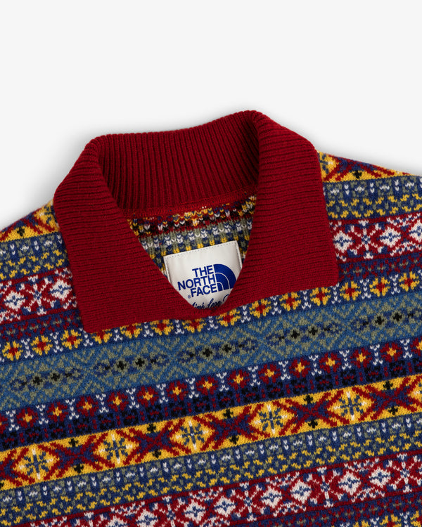 Close-up of the ALD / The North Face Fair Isle Knit Polo with a red collar and inner The North Face label.
