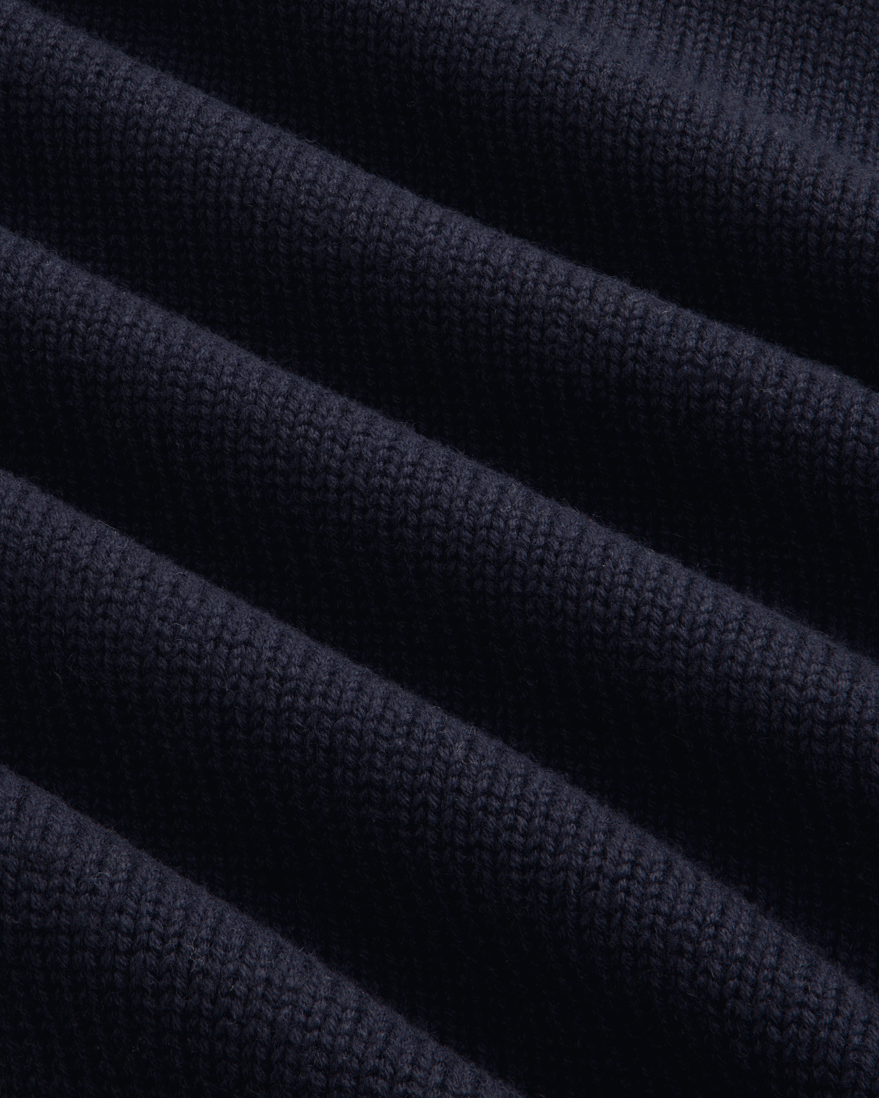 Close-up of Regatta Embroidered Crewneck Sweater’s ribbed knit fabric, highlighting its texture and softness.