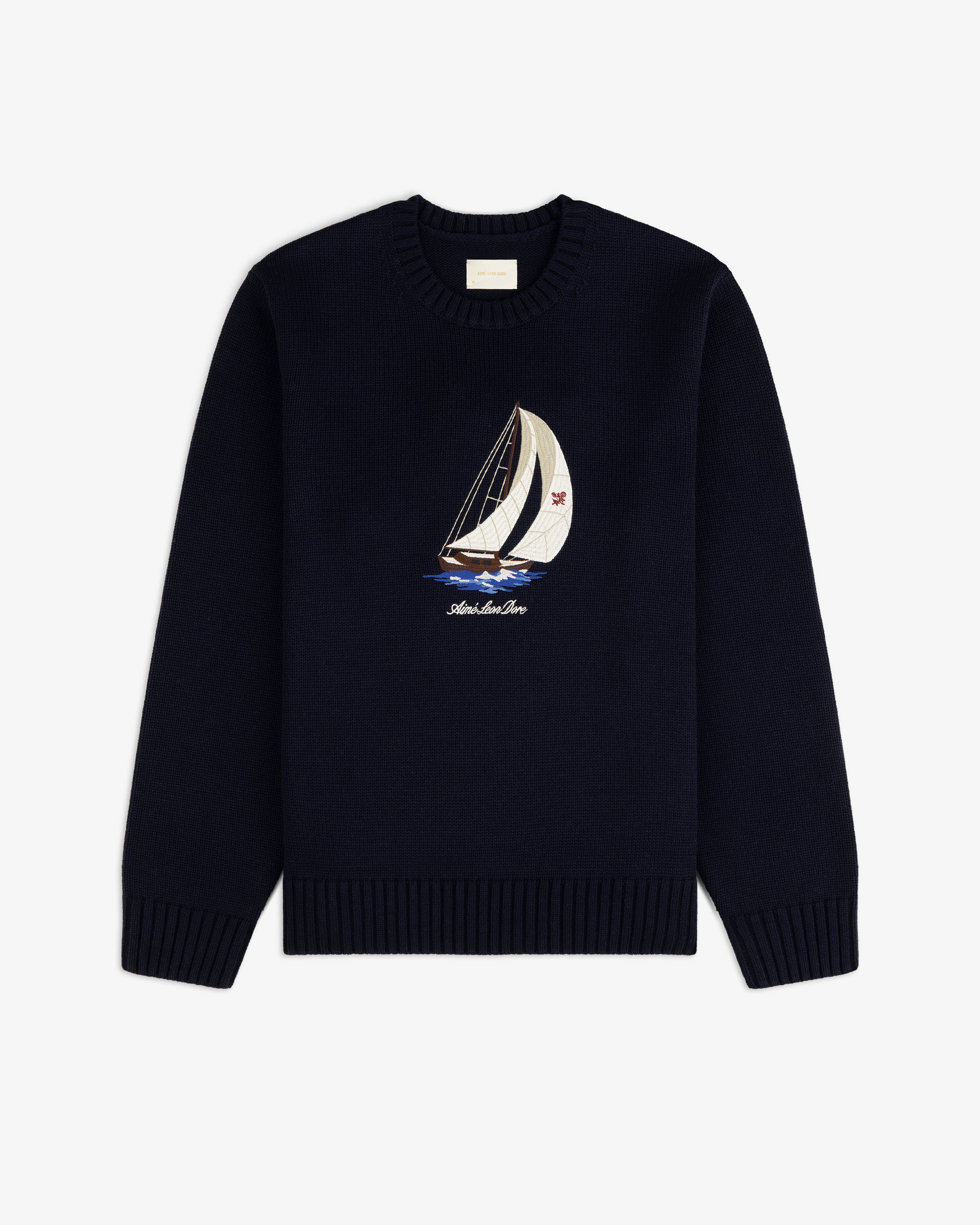 Regatta Embroidered Crewneck Sweater in navy with sailboat design, displayed flat on a white background.