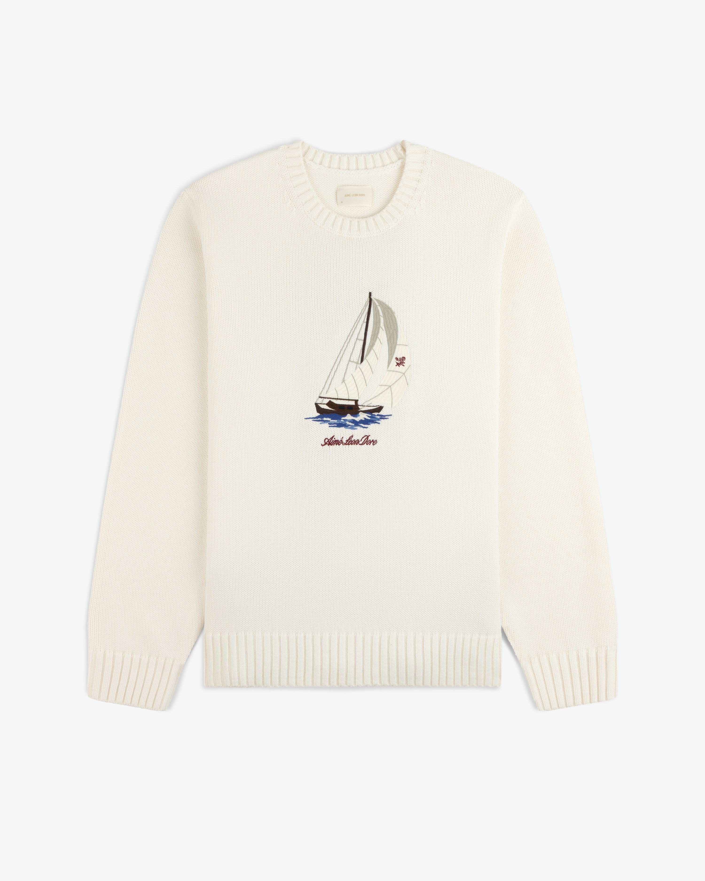 Regatta Embroidered Crewneck Sweater: White with sailboat and waves embroidery, ribbed cuffs and hem.