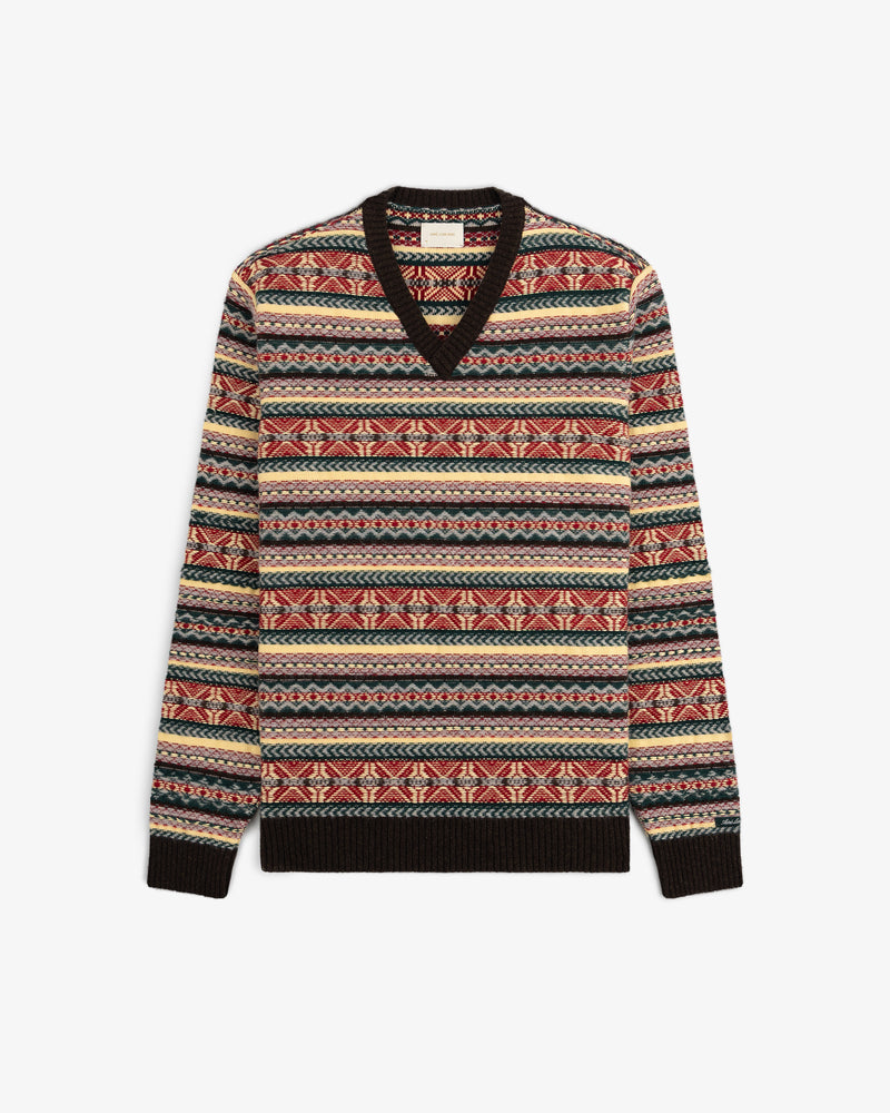 Fair Isle V-Neck Sweater with vibrant geometric stripes in red, beige, blue, and black.