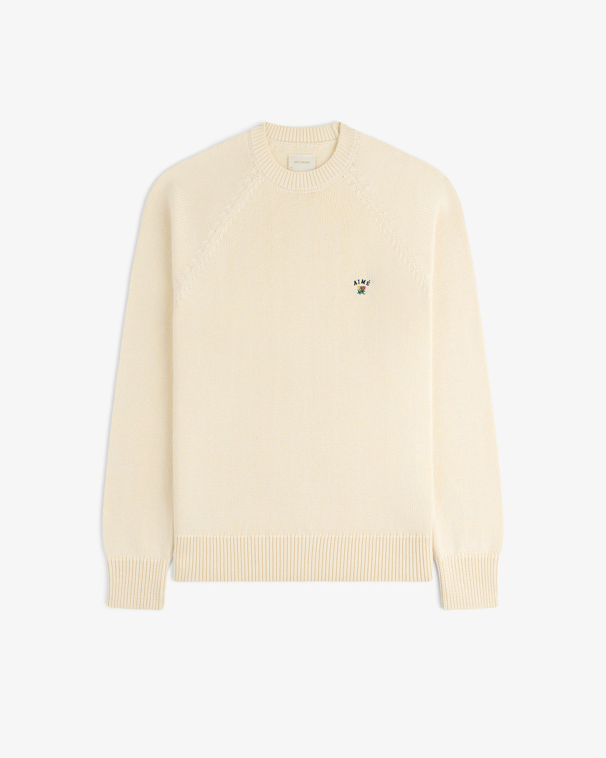 Crest Raglan Sweater: Cream knit, long sleeves, small embroidered logo on left chest.