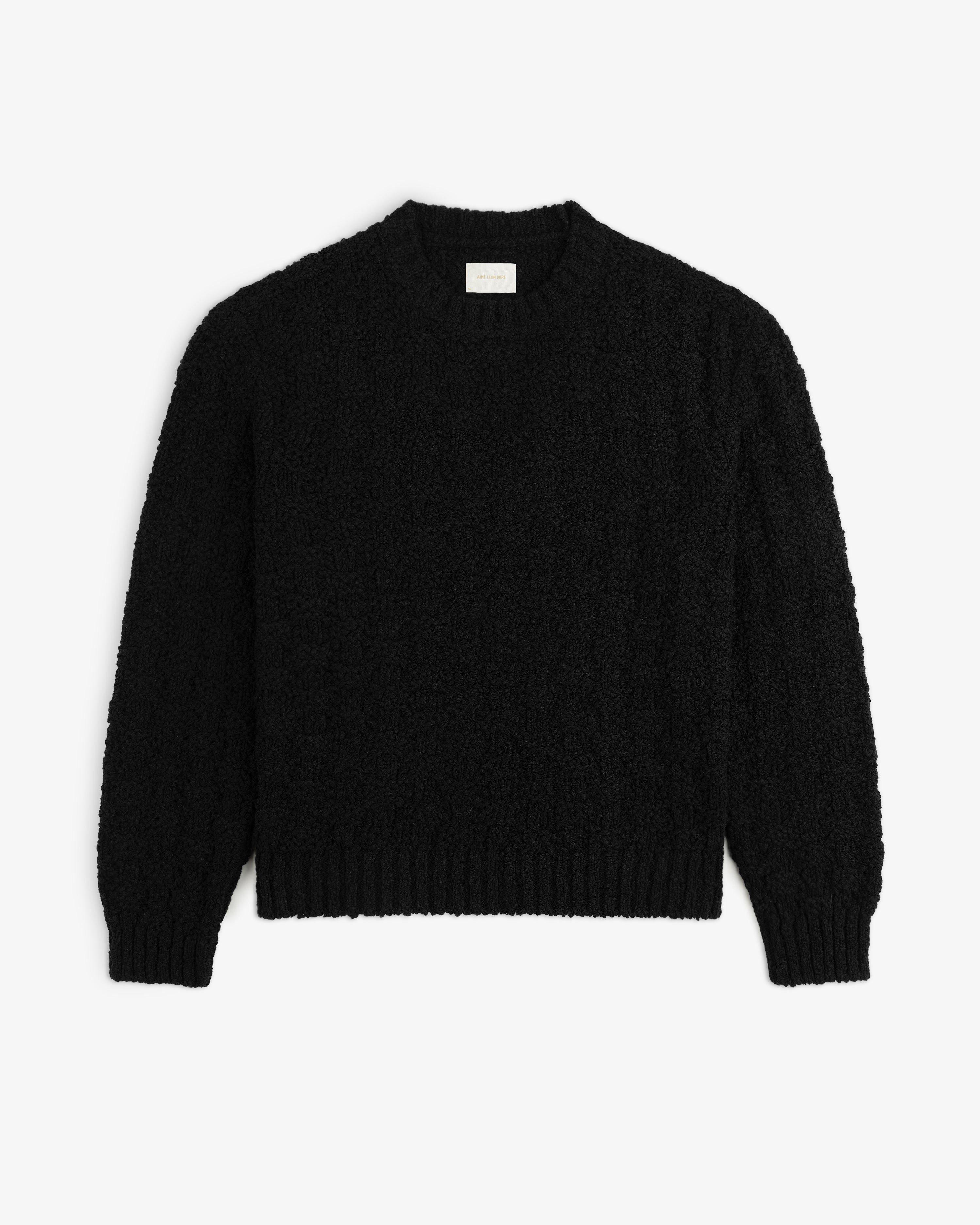 Black Checkerboard Bouclé sweater with a long-sleeved, textured, looped knit and ribbed cuffs and hem.