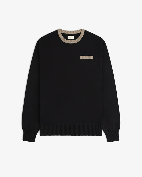 Knit Pocket Crewneck Sweater in black with a contrasting tan ribbed collar and chest pocket trim.