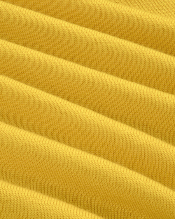 Close-up of yellow Merino Wool Knit Cycling Polo, showing ribbed texture and fine knit detail.