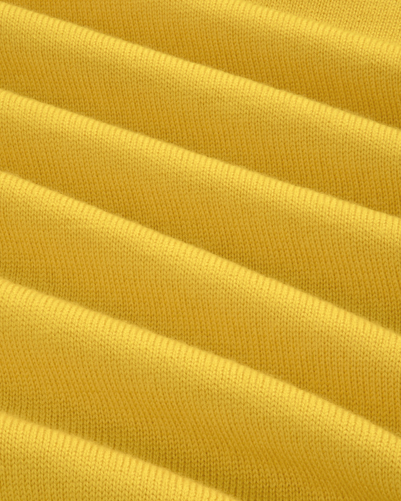 Close-up of yellow Merino Wool Knit Cycling Polo, showing ribbed texture and fine knit detail.