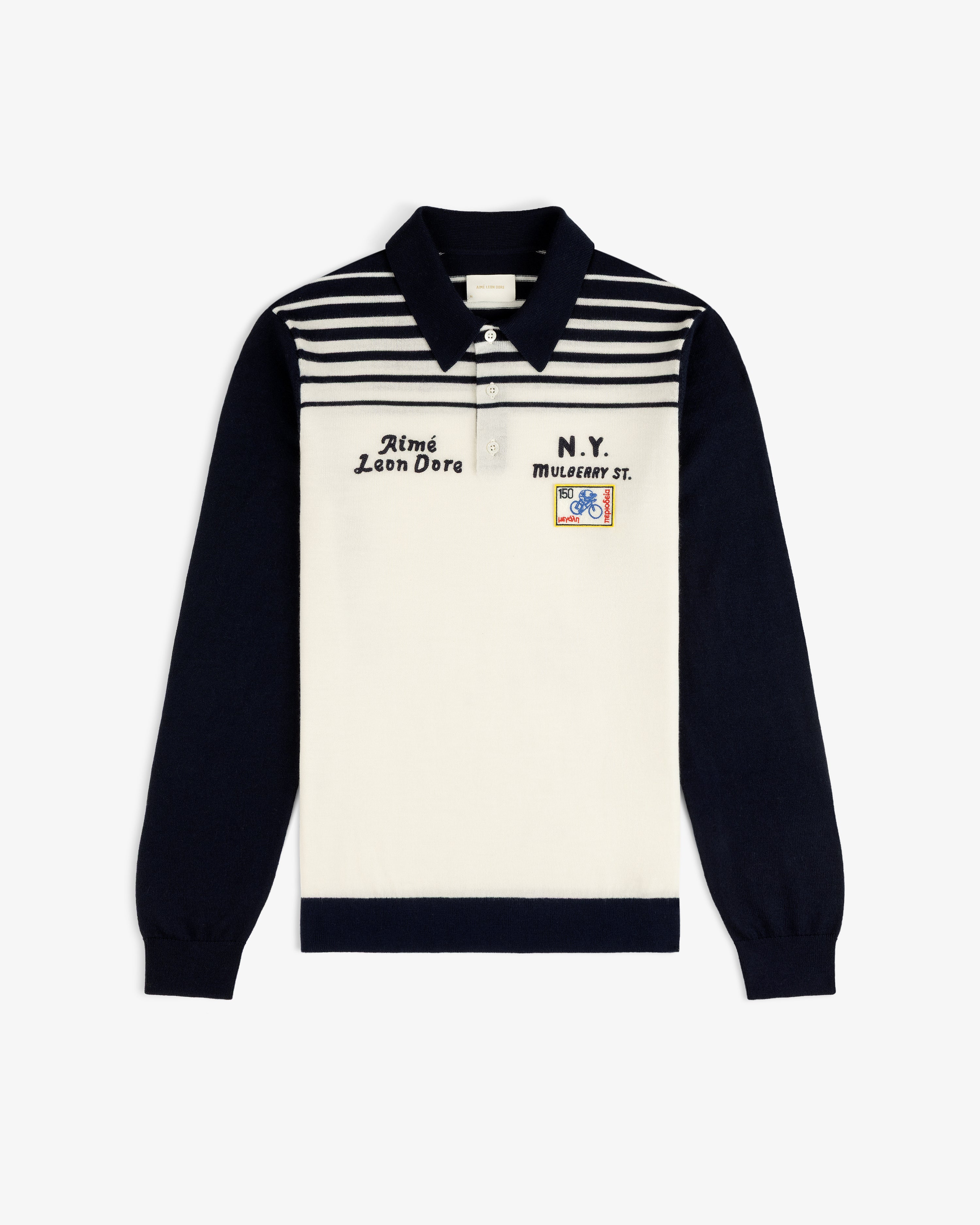 Merino Wool Knit Cycling Polo with navy sleeves, striped chest, and front embroidery and patches.