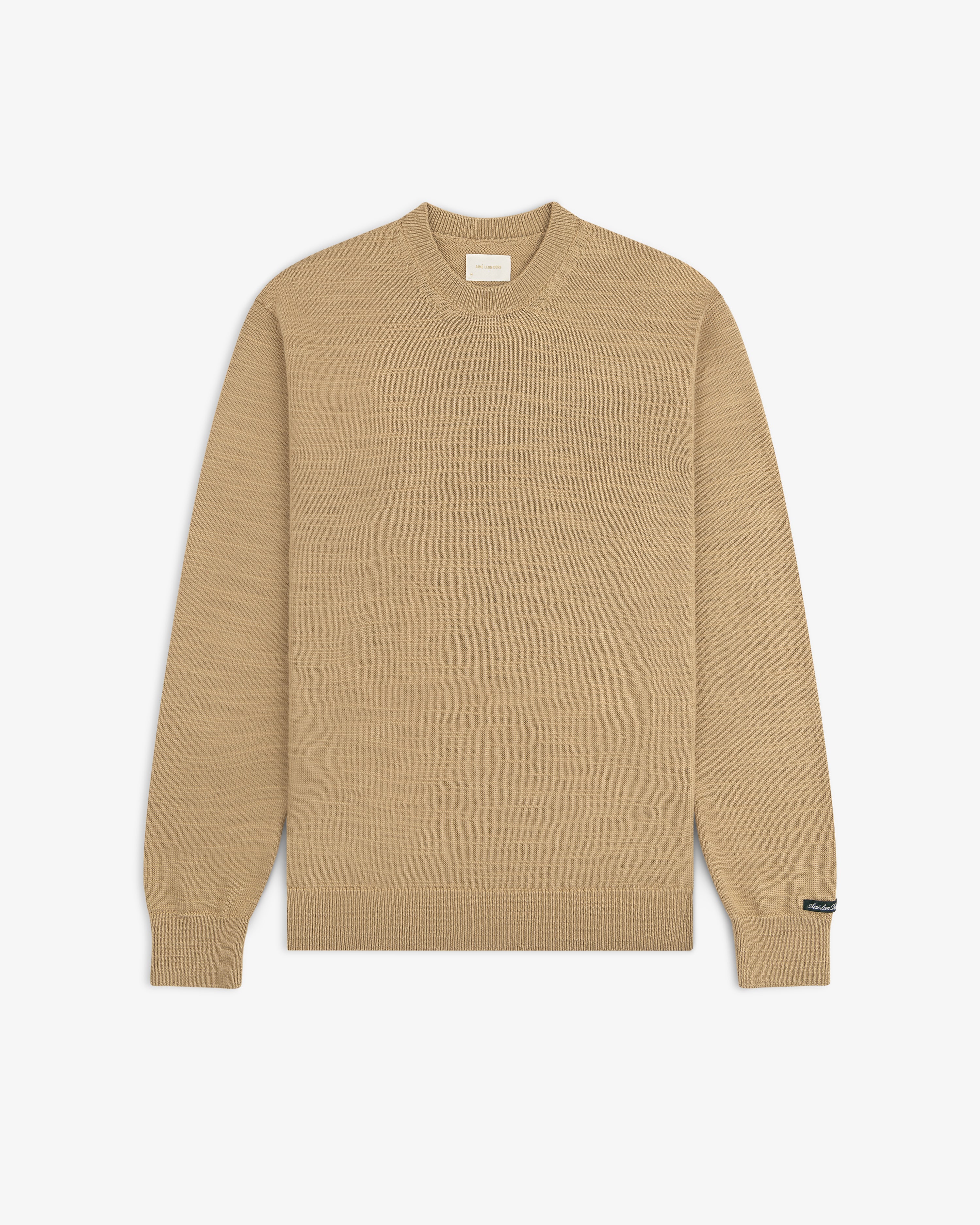 Slub Merino Wool Sweater in tan with a textured knit finish and ribbed cuffs.