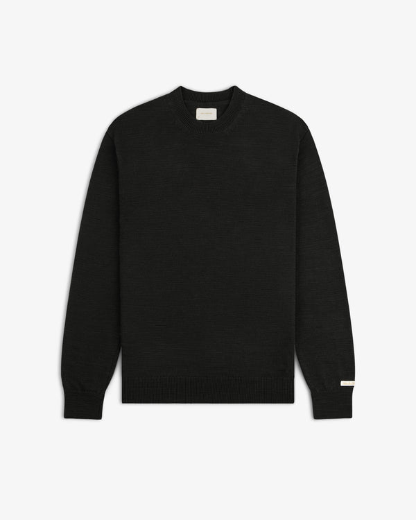 Black Slub Merino Wool long-sleeve crewneck sweater with a textured knit.
