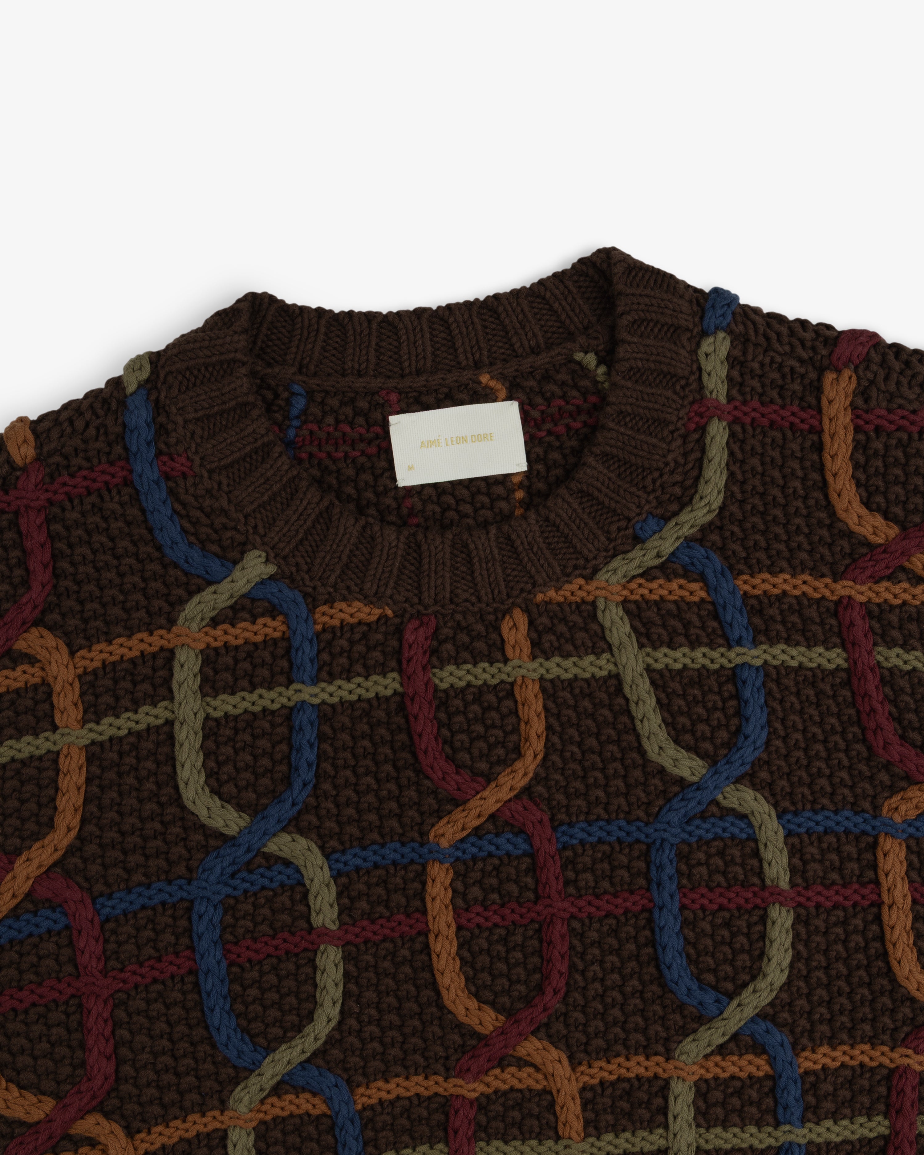 Cable Link Crewneck Sweater in dark brown with a multicolored cable link pattern in blue, olive, and rust.