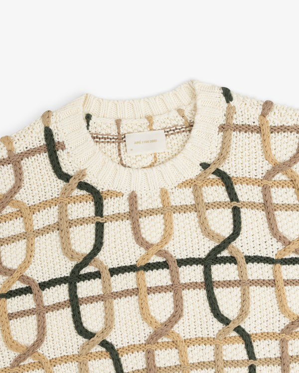 Cable Link Crewneck Sweater in cream with a repeating, interlocking chain pattern in green and tan.