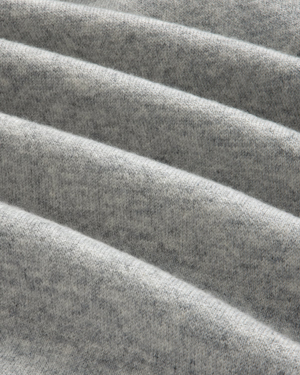 Close-up of folded Pavilion Cashmere Sweatpant in light gray, showing its soft, textured surface with horizontal ridges.