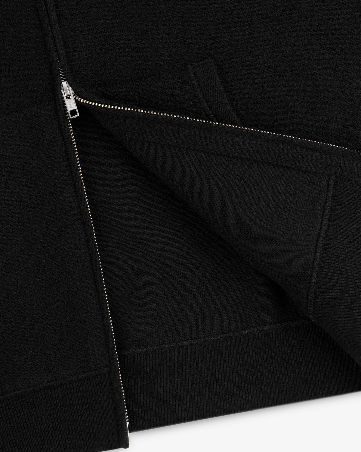 Close-up of the Full-Zip Pavilion Cashmere Hoodie, partially unzipped to highlight fabric and front pocket details.