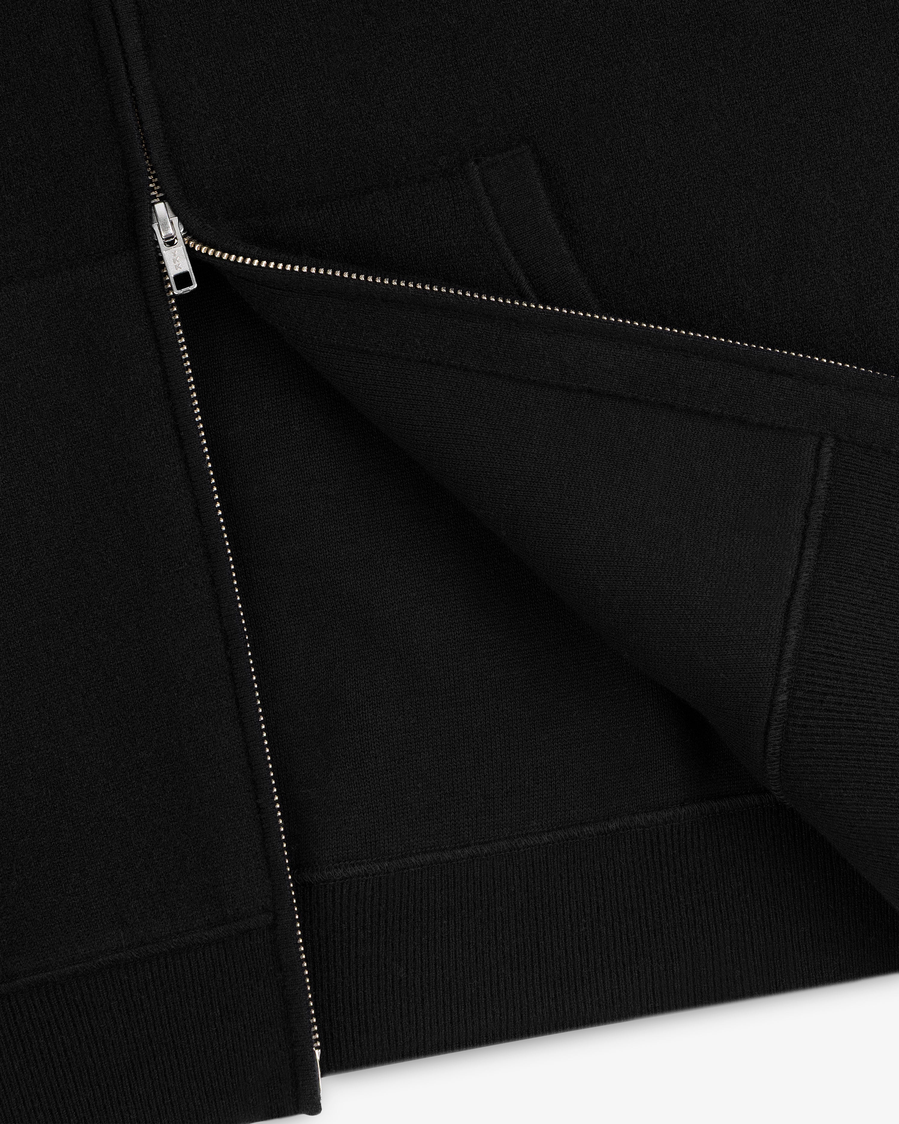 Close-up of the Full-Zip Pavilion Cashmere Hoodie, partially unzipped to highlight fabric and front pocket details.
