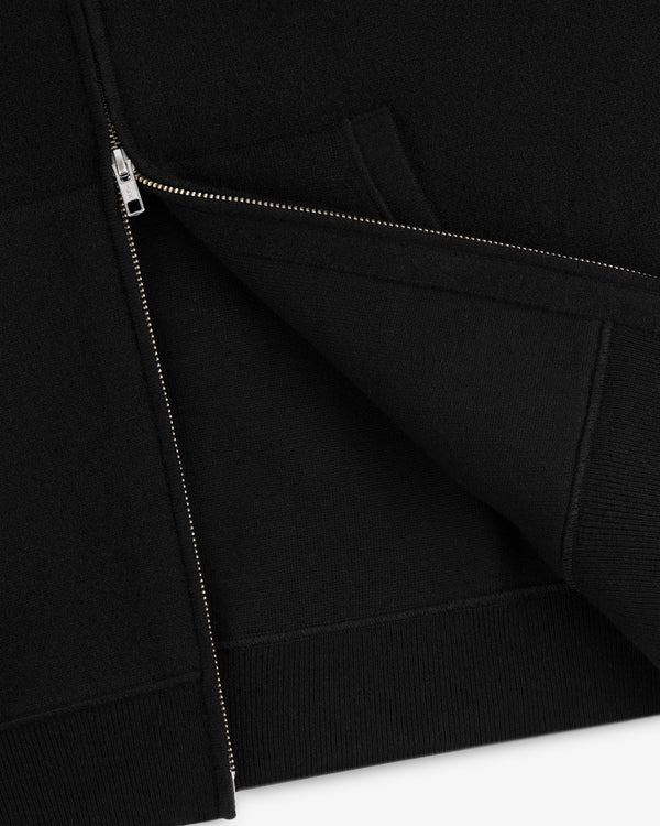 Close-up of the Full-Zip Pavilion Cashmere Hoodie, partially unzipped to highlight fabric and front pocket details.