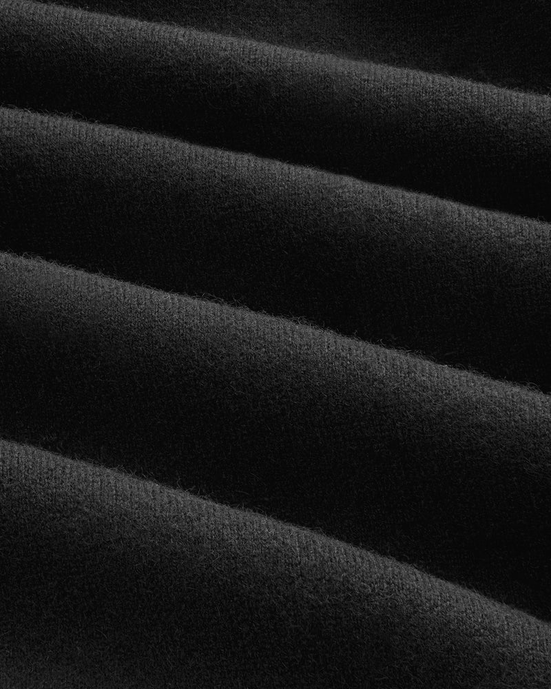 Close-up of Pavilion Cashmere Sweatpant: soft black fabric with even horizontal ridges and a velvety texture.