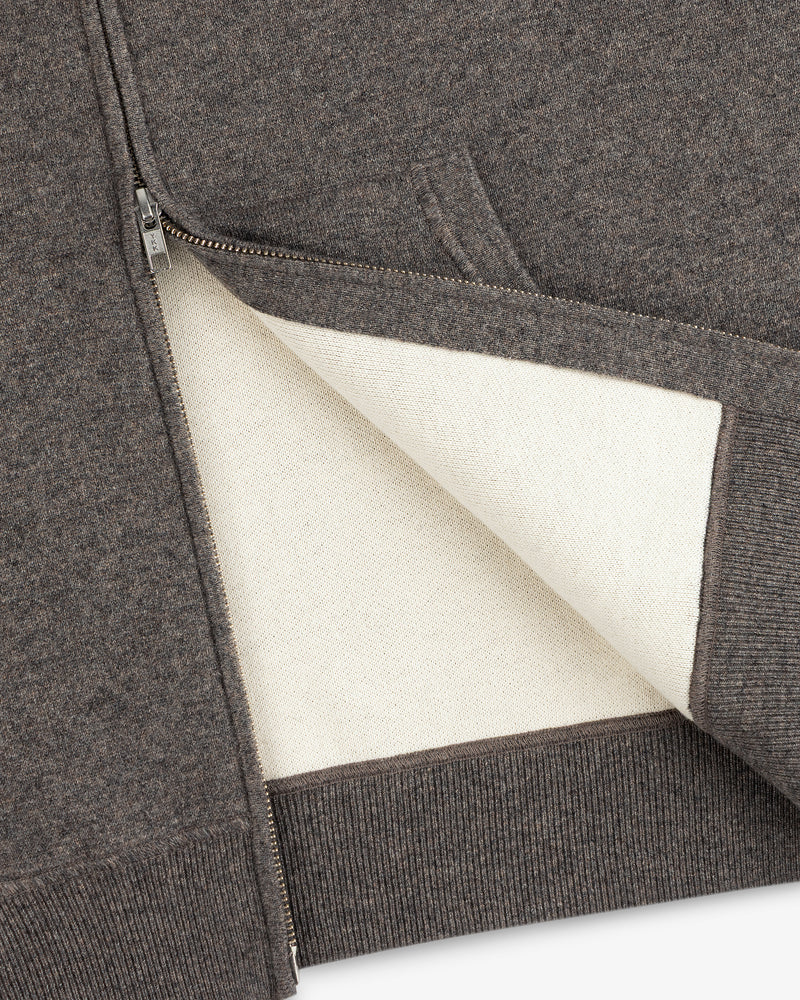 Close-up of the Full-Zip Pavilion Cashmere Hoodie with a soft white lining and ribbed hem.