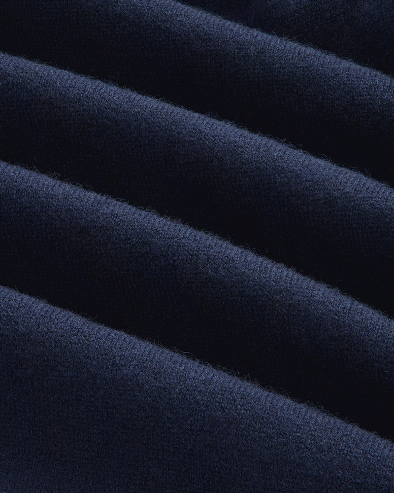 Close-up of the Full-Zip Pavilion Cashmere Hoodie’s dark blue, ribbed fabric with soft, even horizontal ridges.
