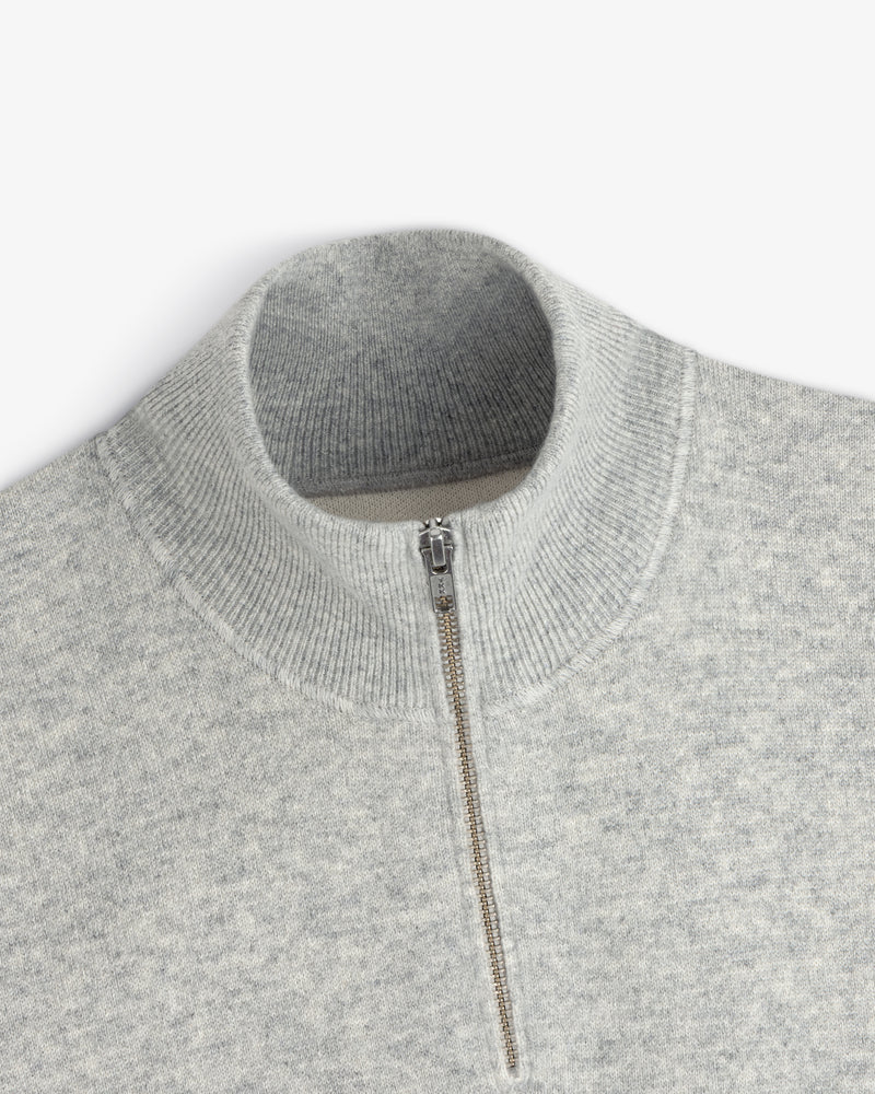 Light gray Pavilion Cashmere Pullover with a ribbed mock neck and quarter-zip silver front.