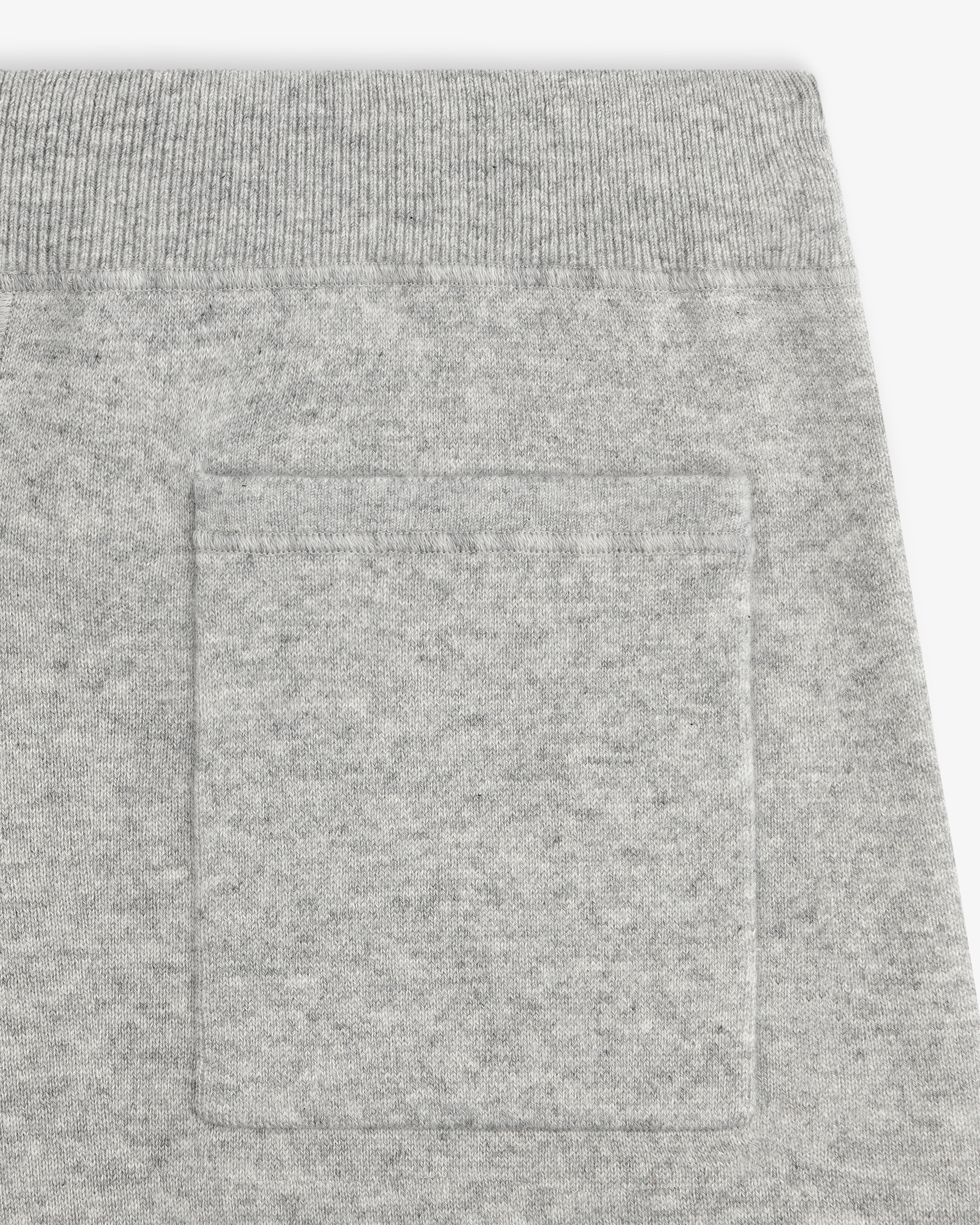 Close-up of the Pavilion Cashmere Sweatpant’s pocket, featuring a ribbed waistband and soft, textured fabric.