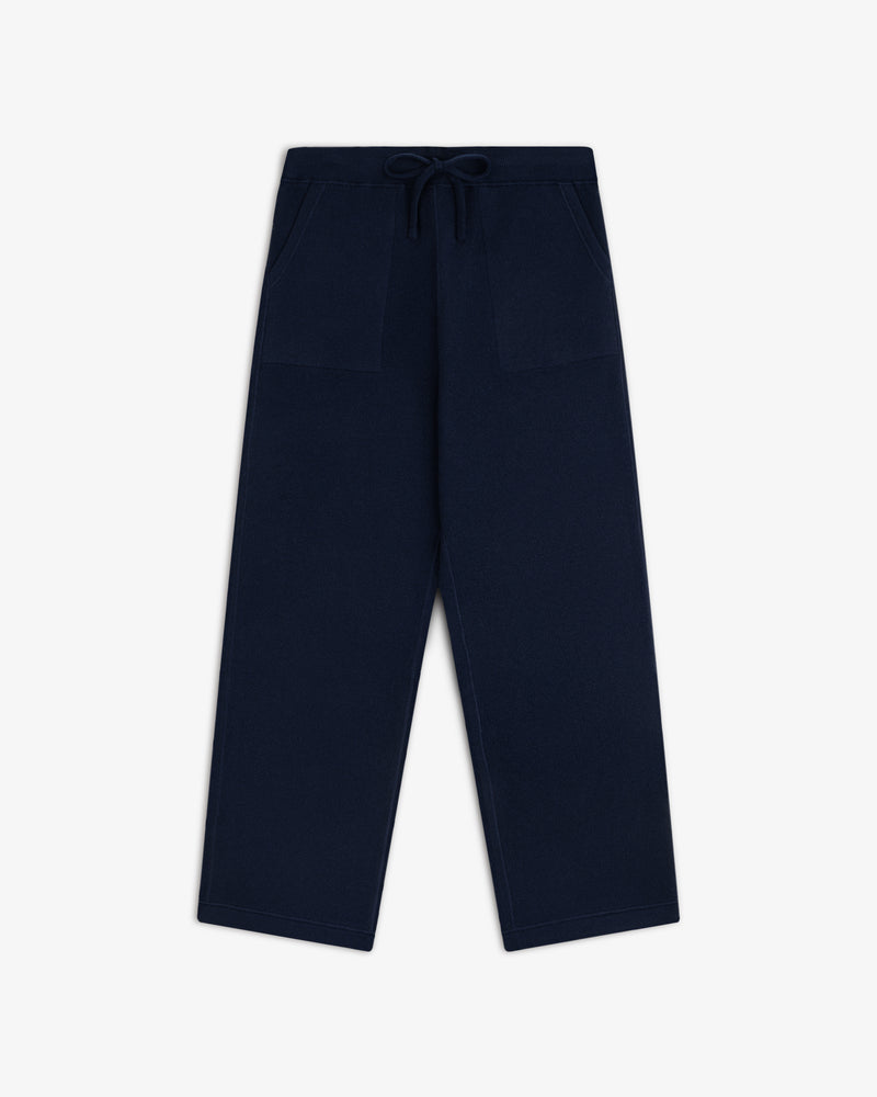 Pavilion Cashmere Sweatpant in navy, wide-leg with front pockets and drawstring waist, shown on white background.