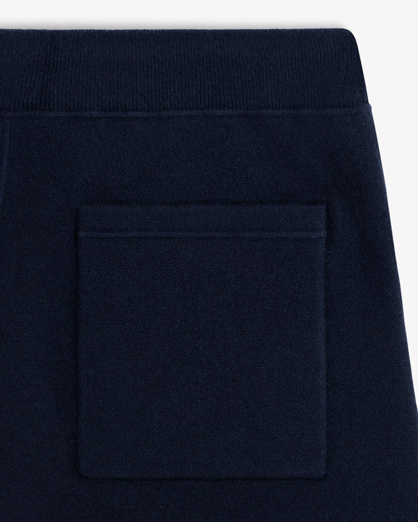 Close-up of Pavilion Cashmere Sweatpant in navy with a square back pocket and ribbed waistband.