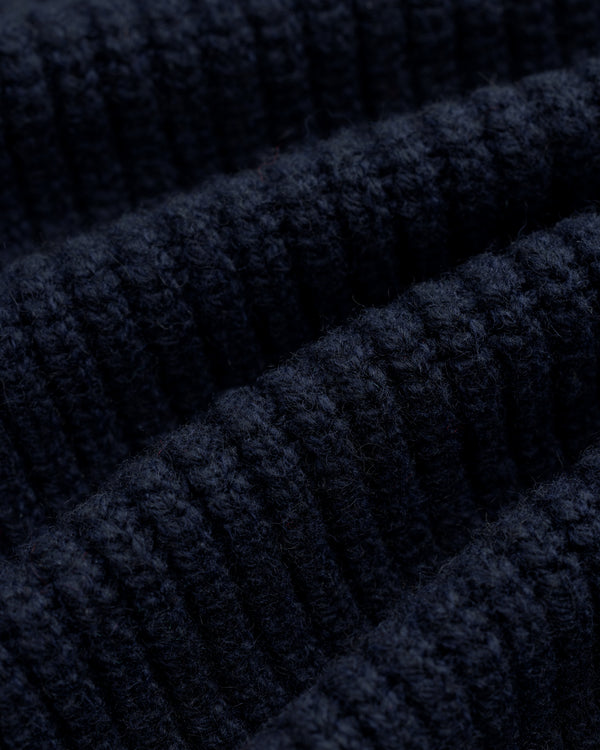 Close-up of NY Highlanders Ribbed Wool Crewneck Sweater in dark blue, highlighting its soft, textured knit rows.