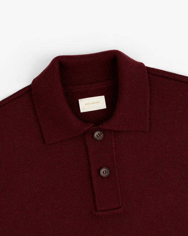 Close-up of a burgundy Long-Sleeve Merino Polo featuring a knit fabric and a two-button placket.