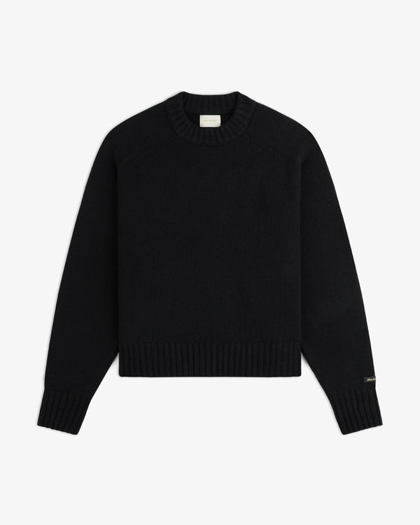 Black Cashmere Crewneck Sweater with ribbed cuffs, collar, and hem.