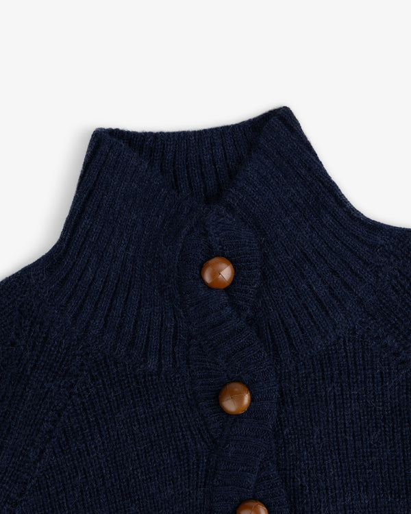 Twisted Rib Cardigan in navy blue knit with a ribbed collar and brown leather buttons.