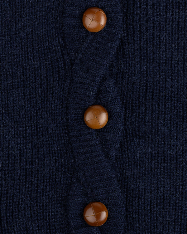 Twisted Rib Cardigan: navy blue cable-knit with three round brown leather buttons.