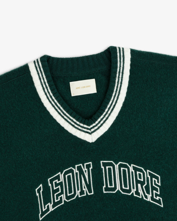 Dark green Boiled Wool Letterman sweater with a V-neck, white striped trim, and LEON DORE embroidered on the chest.