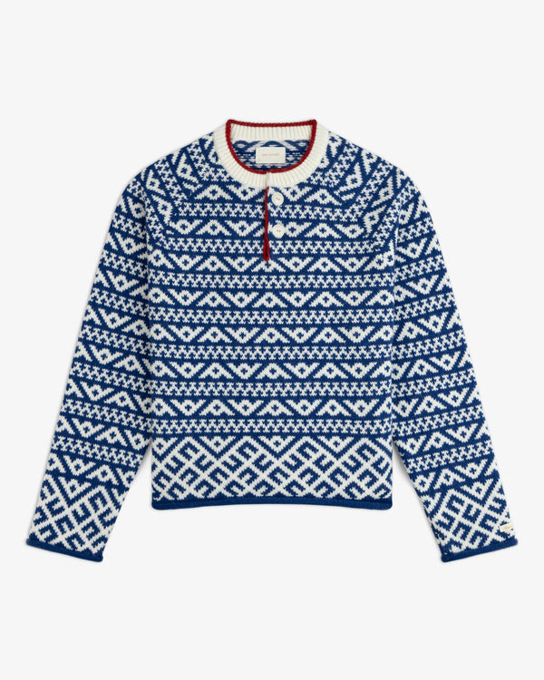 Poros Jacquard Pullover featuring a blue and white geometric fair isle pattern, a three-button placket, and red trim.
