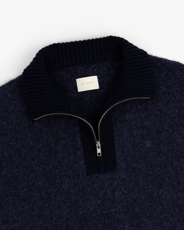 Alpaca Wool Quarter Zip Sweater in navy, fuzzy texture, ribbed collar, gold zipper, shown flat on a white background.