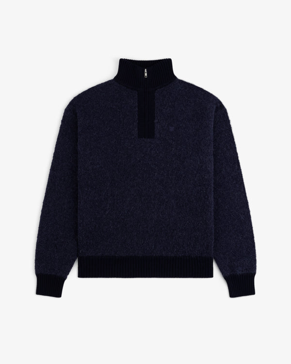 Navy Alpaca Wool Quarter Zip Sweater with long sleeves and ribbed cuffs, collar, and hem.