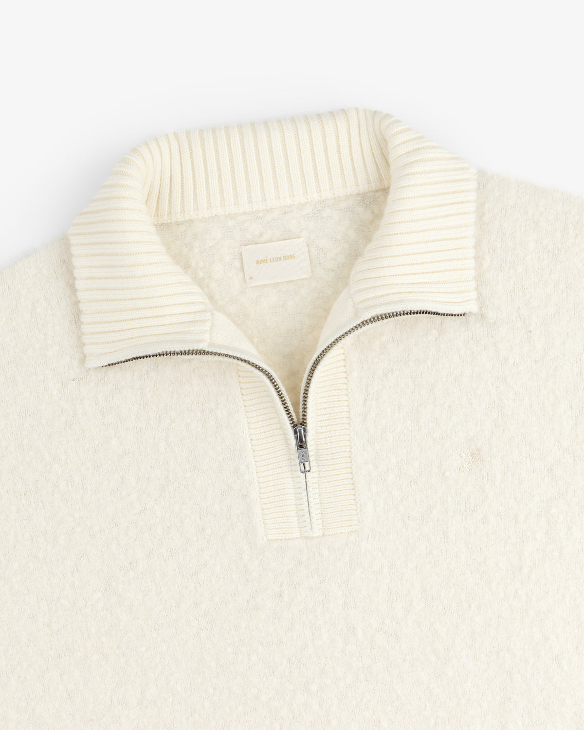Alpaca Wool Quarter Zip Sweater in cream with ribbed stand collar, shown flat on a white background.