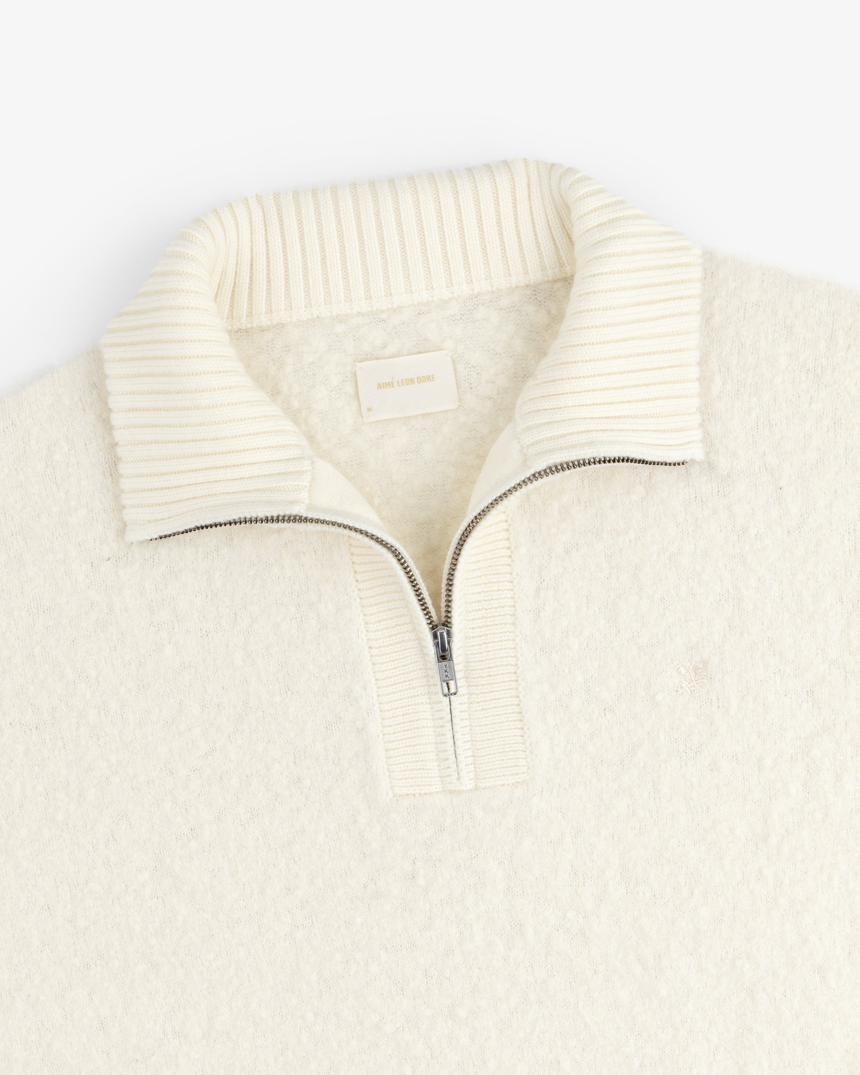 Alpaca Wool Quarter Zip Sweater in cream with ribbed stand collar, shown flat on a white background.