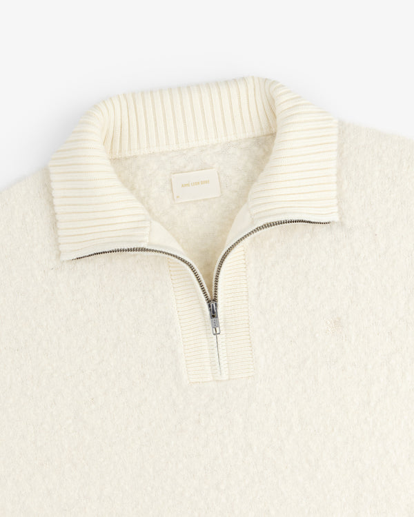 Alpaca Wool Quarter Zip Sweater in cream with ribbed stand collar, shown flat on a white background.