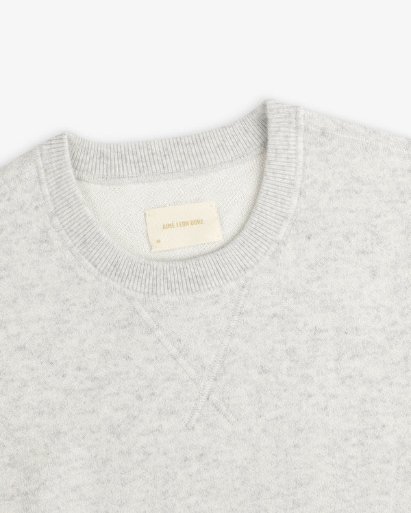 Light gray Pavilion Cashmere Crewneck Sweatshirt with ribbed collar and AIME LEON DORE tag inside.