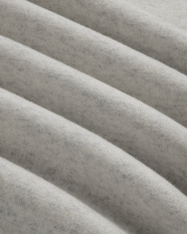 Close-up of Pavilion Cashmere Crewneck Sweatshirt in light gray, showing soft ribbed fabric and horizontal ridges.