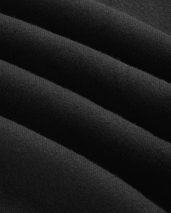 Close-up of Pavilion Cashmere Crewneck Sweatshirt in soft black fabric with horizontal folds and texture.