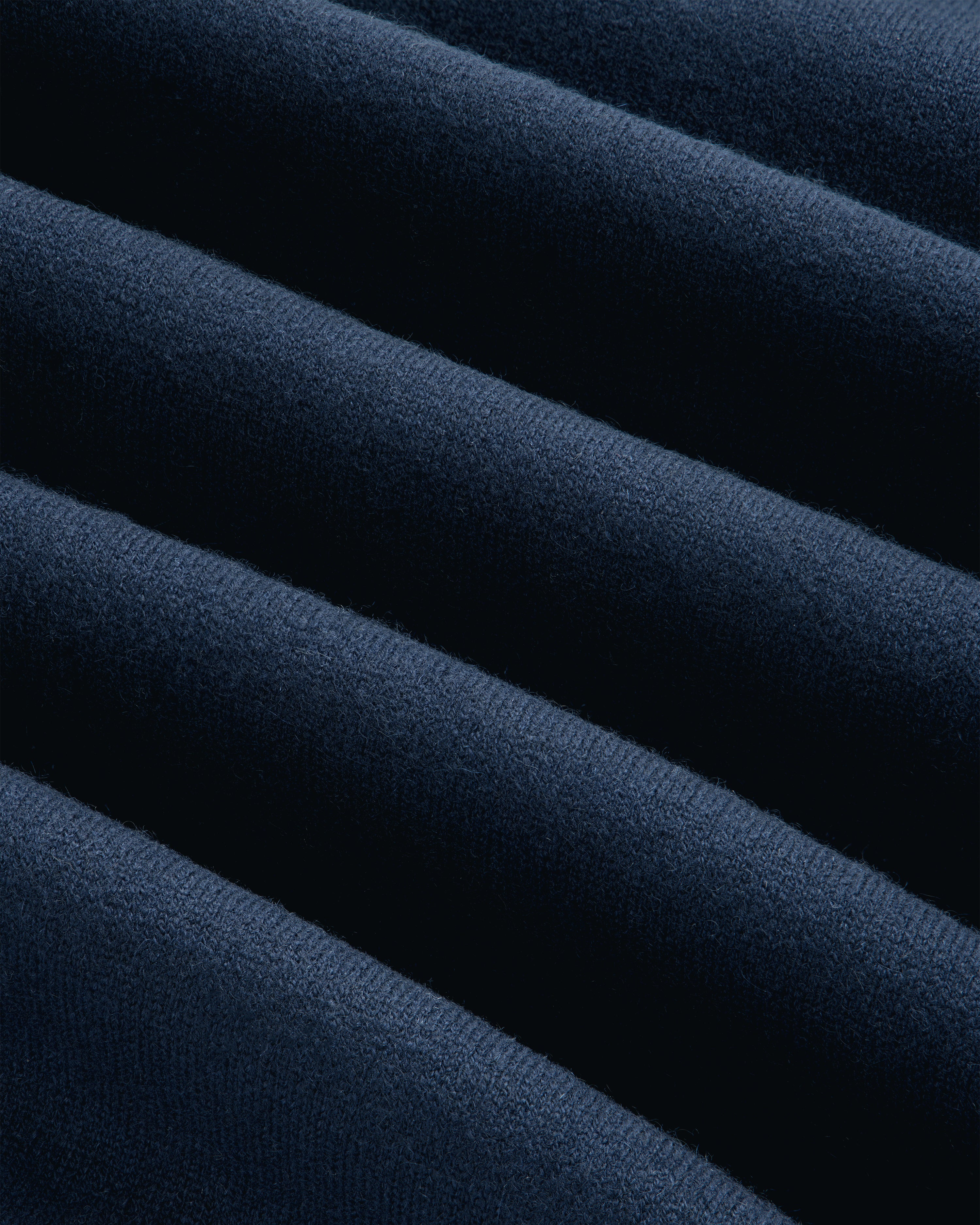 Close-up of Pavilion Cashmere Crewneck Sweatshirt in dark blue, featuring soft ridges and parallel textured lines.
