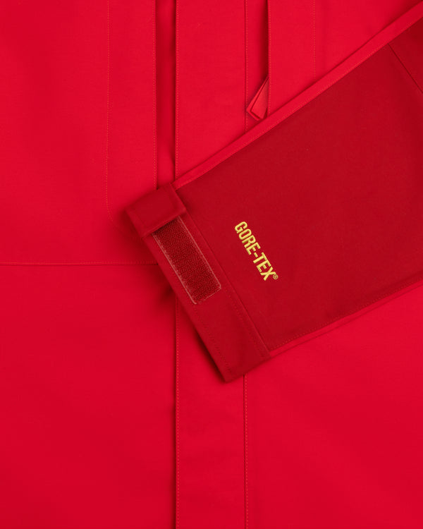 Close-up of ALD/The North Face GORE-TEX 2000 Mountain Jacket sleeve with yellow text and Velcro cuff strap.
