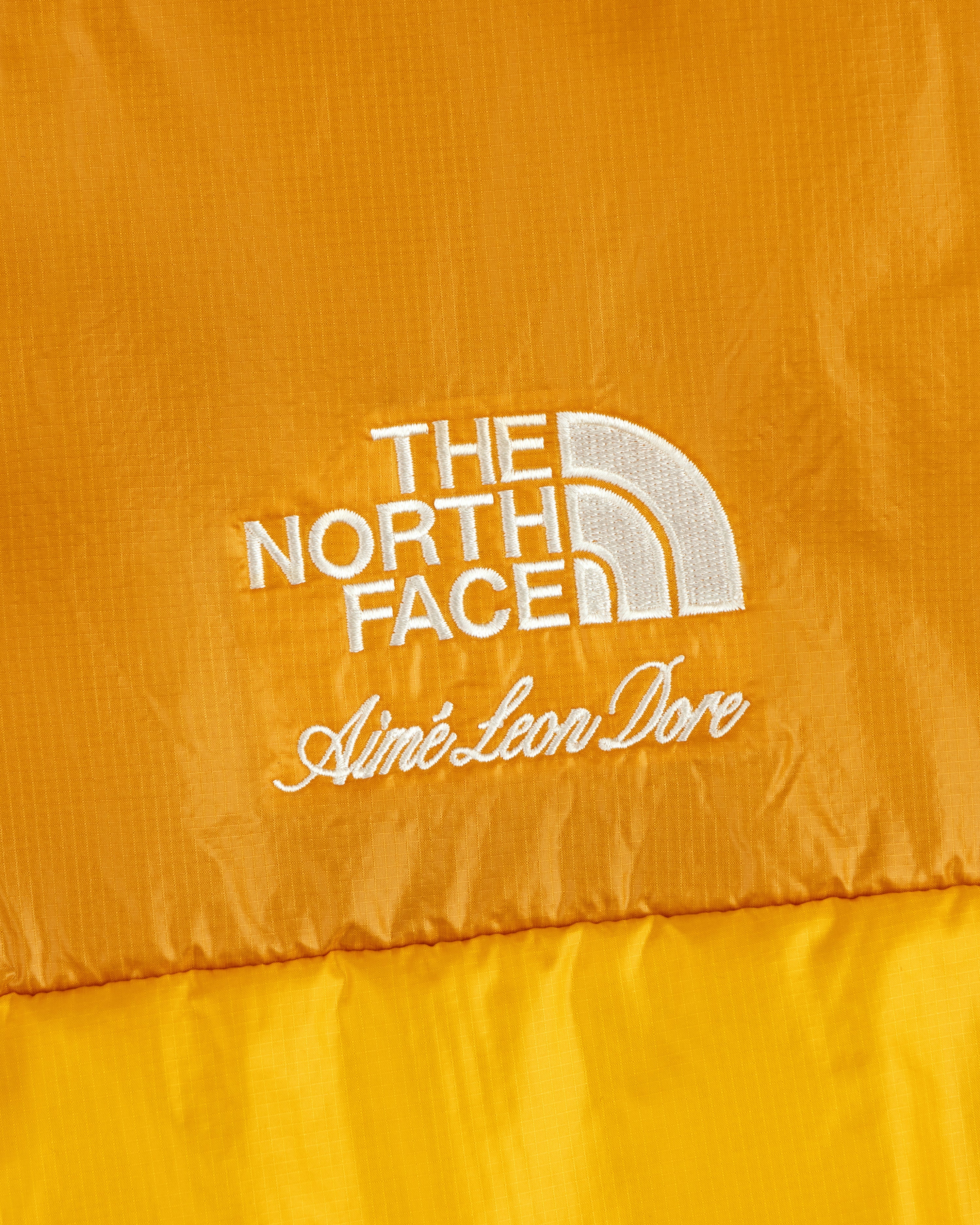 Yellow ALD / The North Face Reversible Pertex® Nuptse Jacket with white embroidered logos.