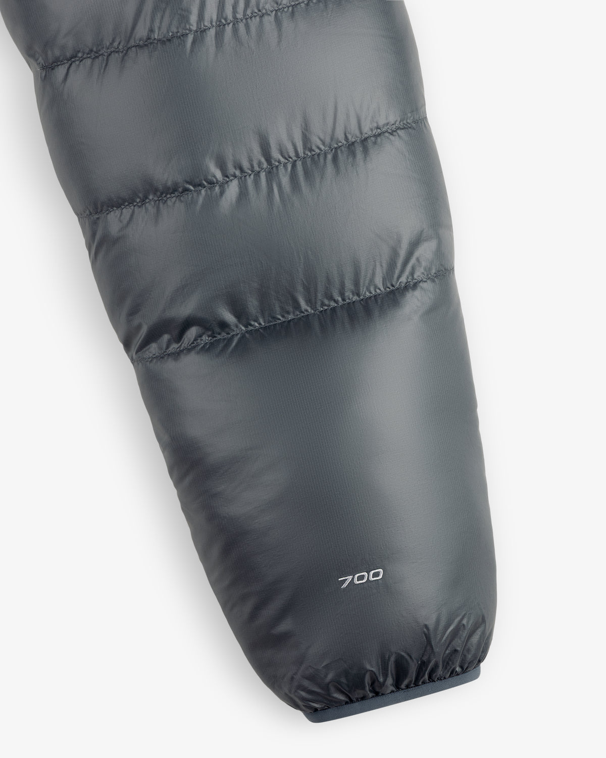Close-up of the ALD / The North Face Reversible Pertex® Nuptse Jacket sleeve with “700” printed by the cuff.