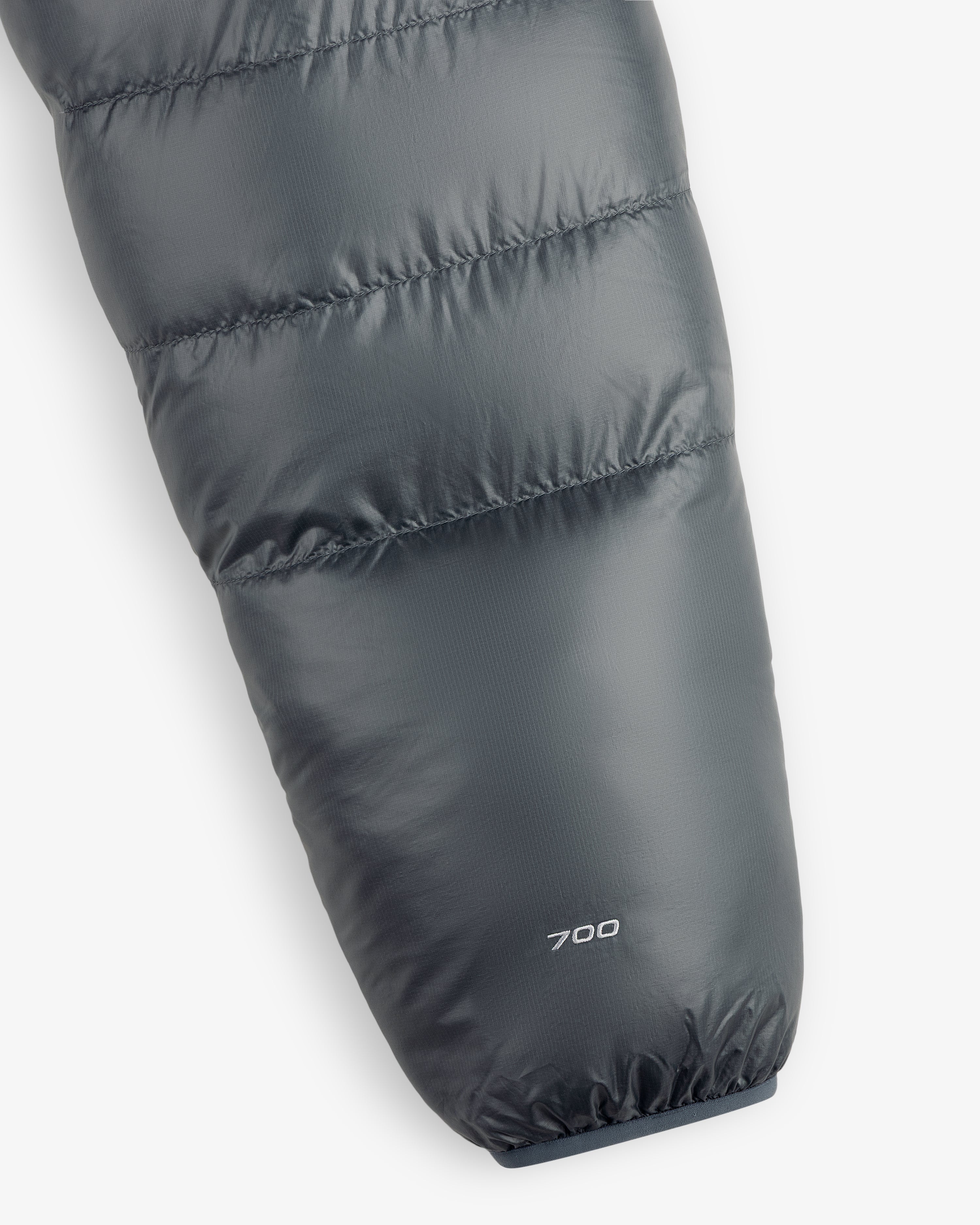 Close-up of the ALD / The North Face Reversible Pertex® Nuptse Jacket sleeve with “700” printed by the cuff.