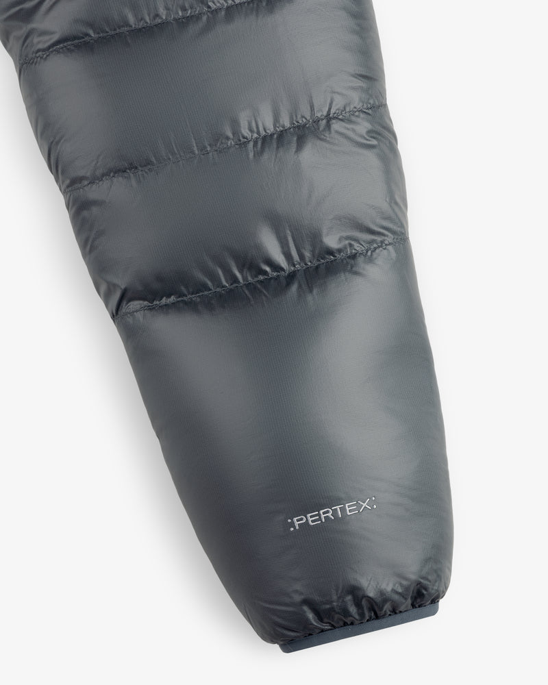 Close-up of ALD/The North Face Reversible Pertex® Nuptse Jacket sleeve with branding on white background.