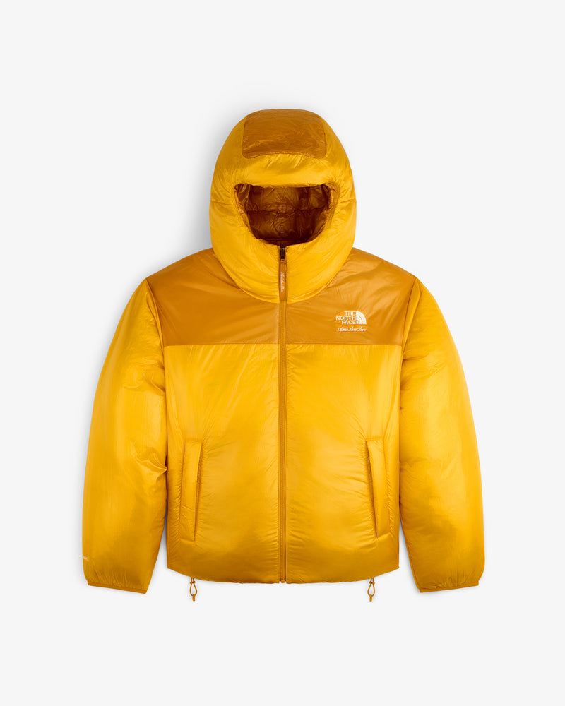 Yellow ALD/The North Face Reversible Pertex® Nuptse Jacket with hood, front zipper, and side pockets on white background.