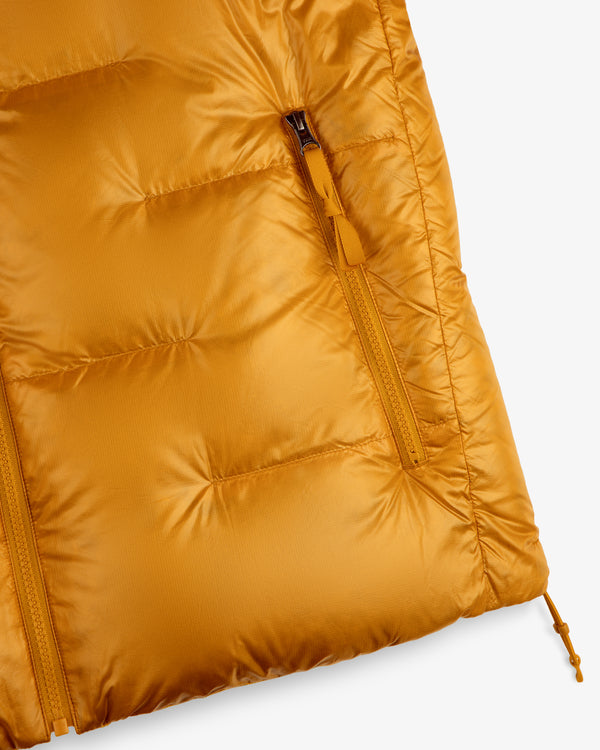 Close-up of ALD/The North Face Reversible Pertex® Nuptse Jacket with a vertical zipper pocket and stitched quilting.